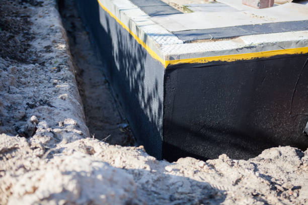 Professional Basement Waterproofing technician working in Spring City, TN